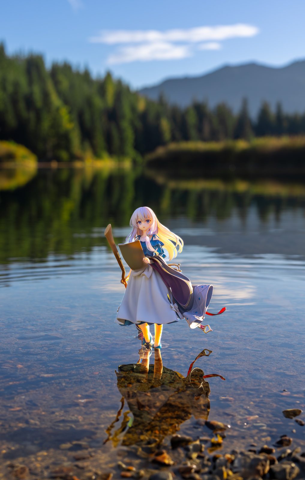 Figure by mountain lake