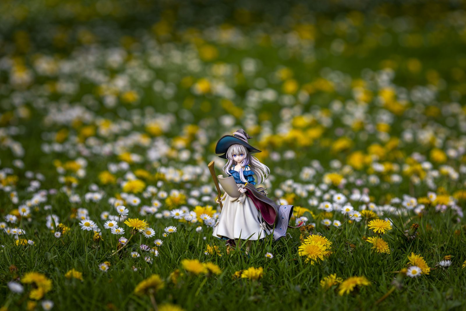Figure in dandelion field