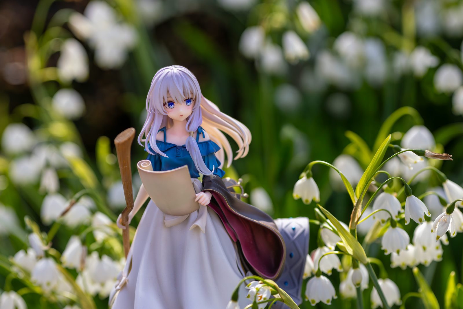 Figure among snowdrops